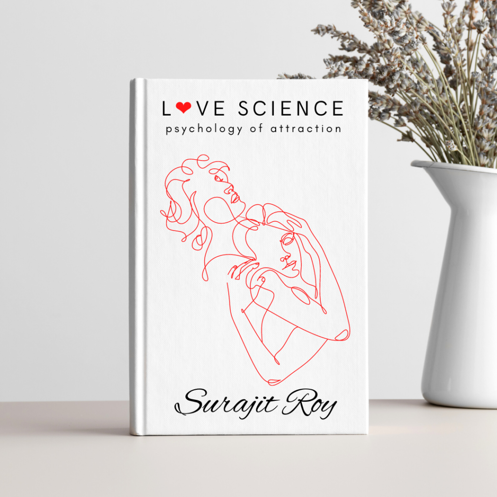 A white vase and a book are placed on the table. A bouquet of some dried flowers is placed in the vase. The book is "Love Science, Psychology of Attraction" written by Surajit Roy. The cover of the book has a pen drawing of a couple. They hugged each other. Red ink is used in the film.