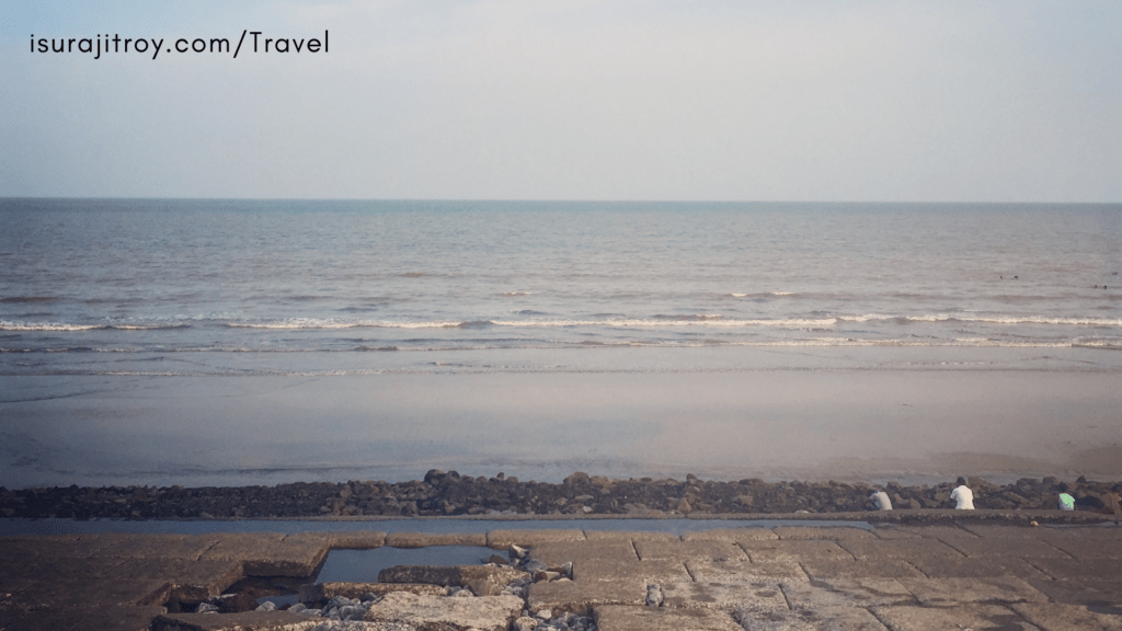 Panoramic view of Digha Beach in West Bengal, India, showcasing golden sands, azure waters, and vibrant coastline against a picturesque horizon.